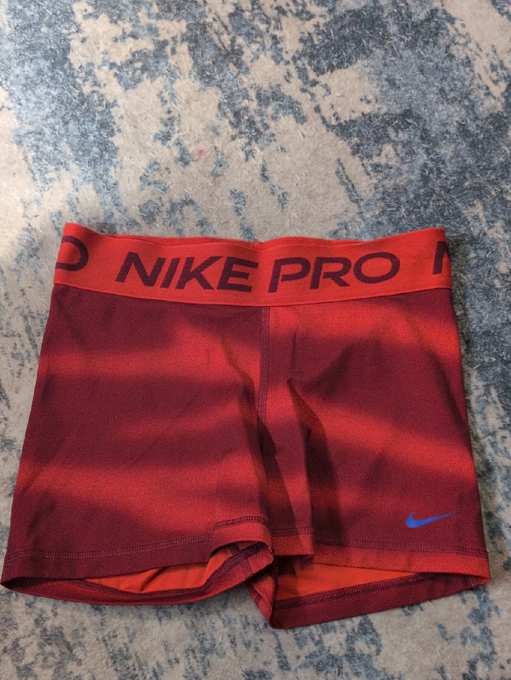Nike Pro Multi Color Compression Shorts with Red Waistband and Blue Logo
